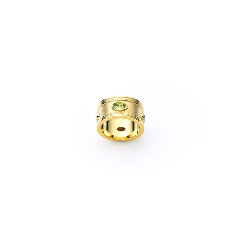 Gold and precious stones ring, jewellery designer, peridot, ruby, citrine, topaz 